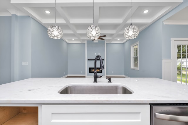 a-kitchen-with-a-sink-and-a-chandelier