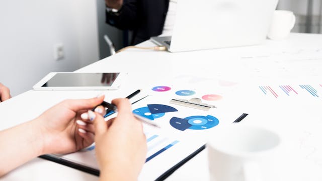 person-holding-black-pen-writing-on-white-paper
