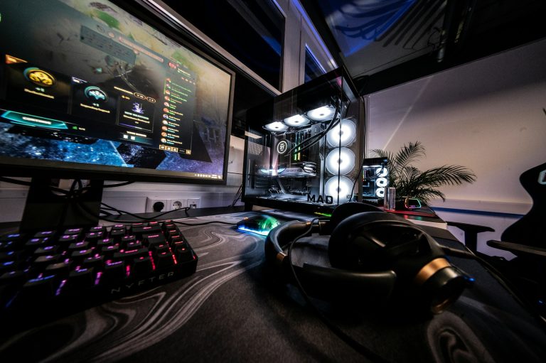 a-computer-desk-with-a-keyboard-mouse-and-monitor
